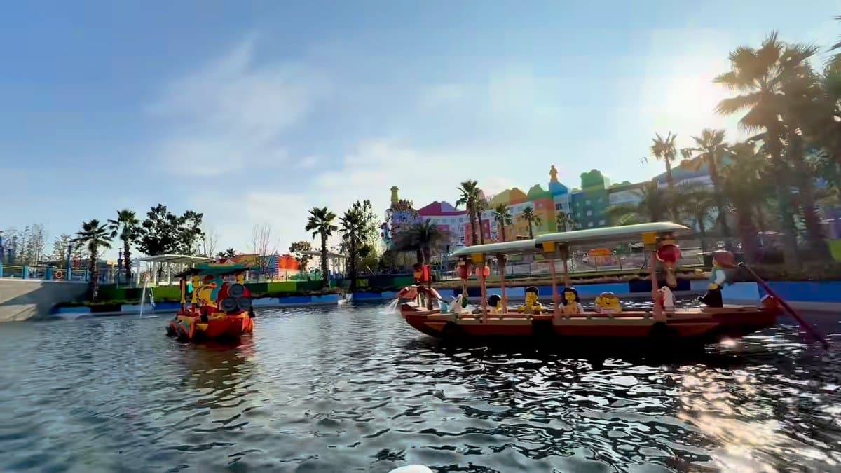 Tour boat beside colourful buildings