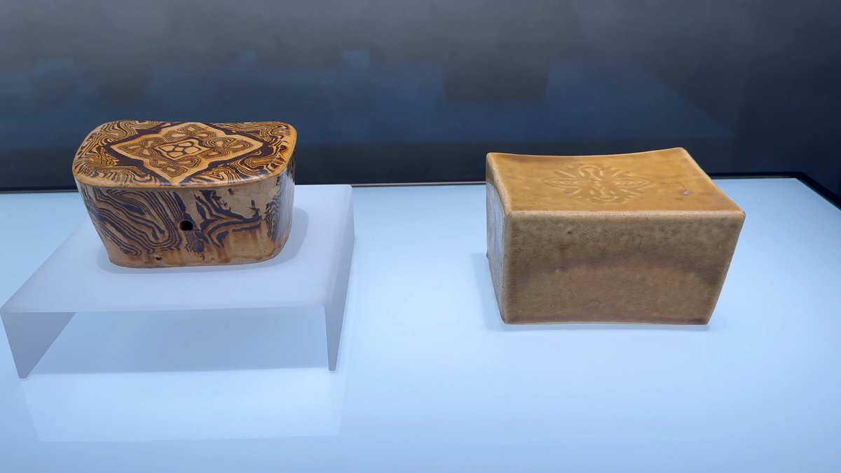 Two ceramic pillows displayed side by side.