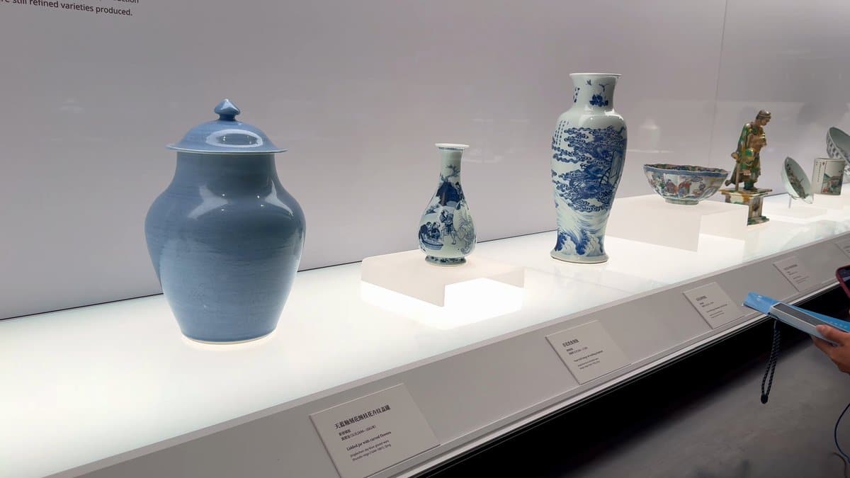 Vases, jars and bowls in pale glazes along
