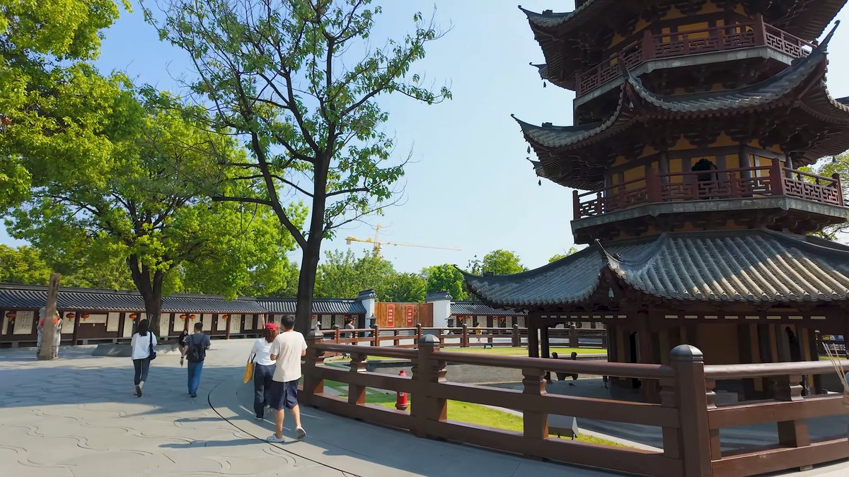 Visitors crossing the pagoda plaza